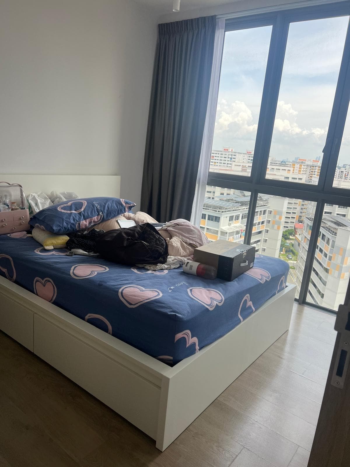 Tidy bedroom with city view